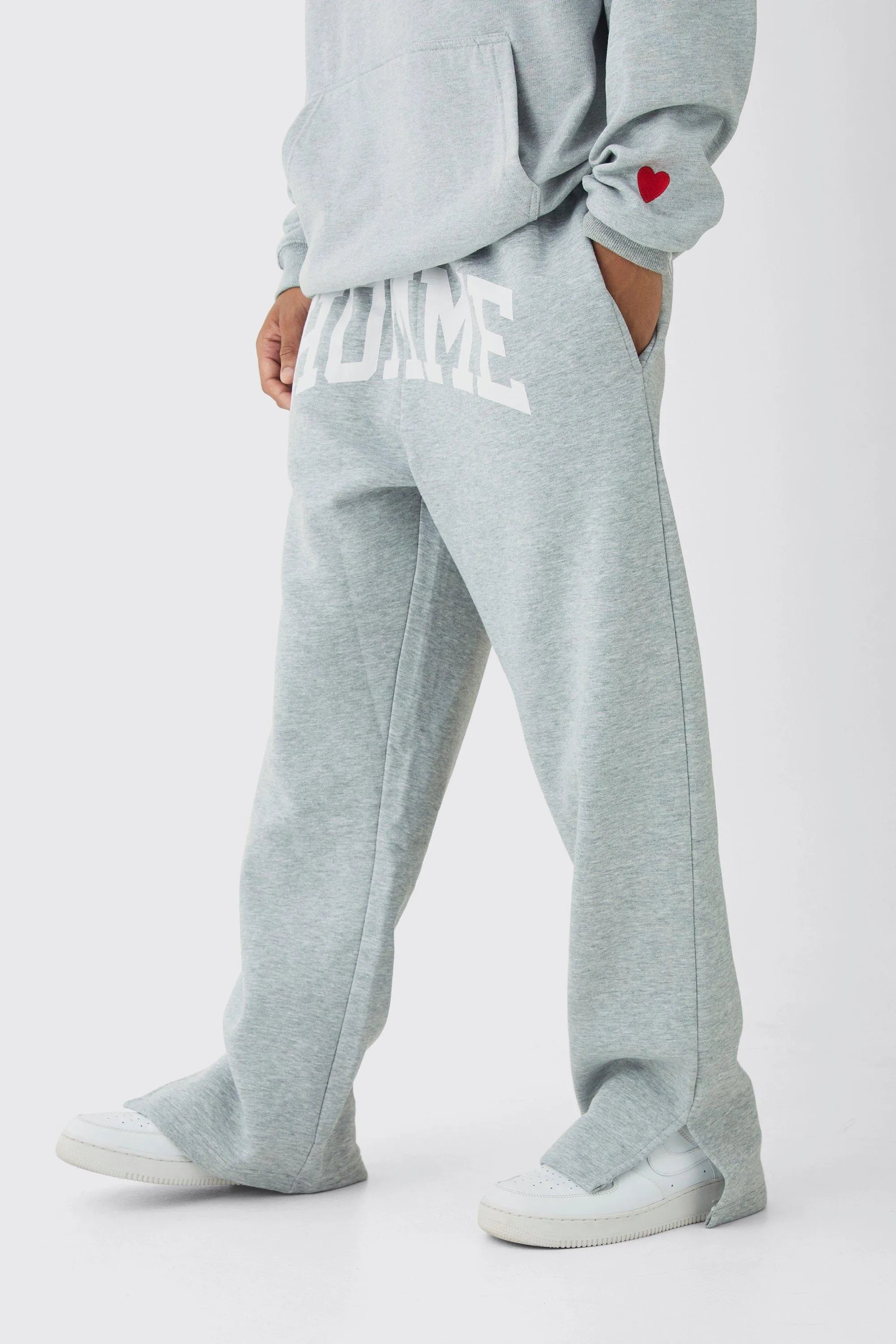 Gerade Jogginghose mit Homme-Print und geteiltem Saum